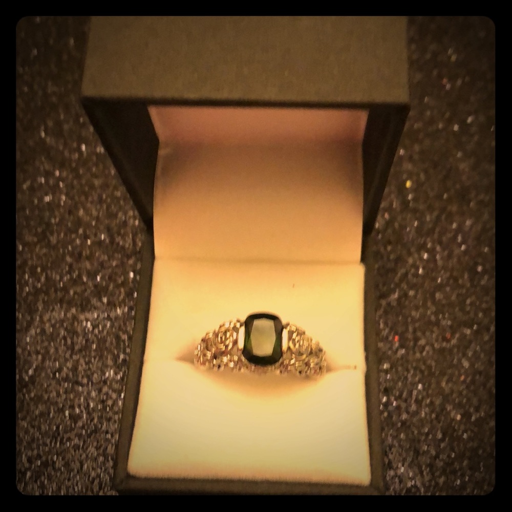 Green stone on stamped 925 silver ring.